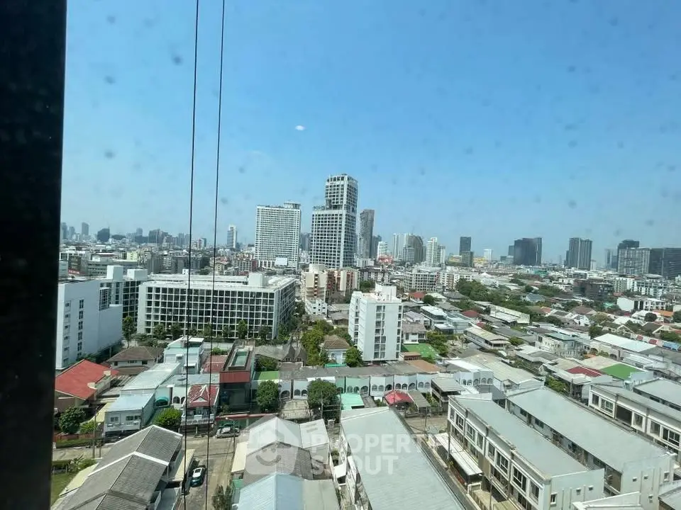 Stunning cityscape view from high-rise building showcasing urban skyline and vibrant neighborhood.