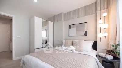 Modern bedroom with stylish decor and cozy ambiance, featuring a comfortable bed and elegant lighting.