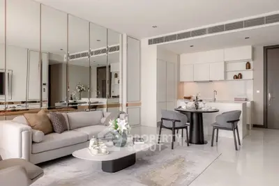 Luxurious modern living room with elegant decor and open kitchen layout, perfect for stylish urban living.