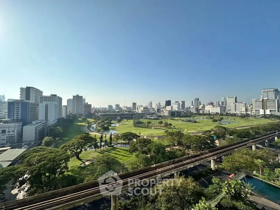 Stunning cityscape view with lush greenery and skyline, perfect for urban living enthusiasts.