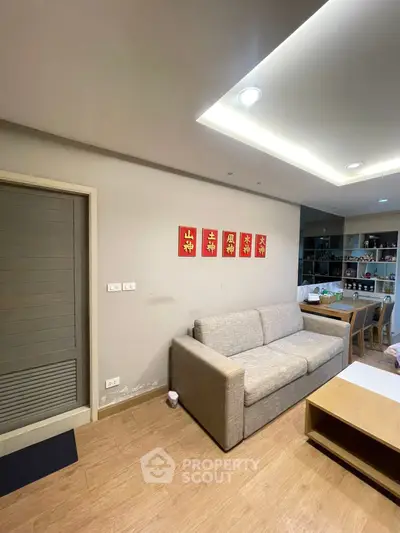 Modern living room with cozy sofa and stylish wooden flooring