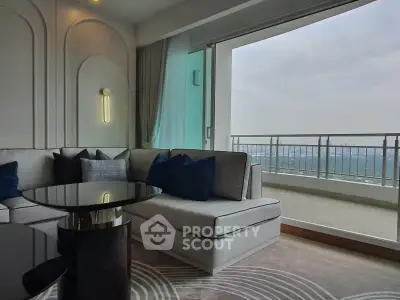 Luxurious living room with modern decor and stunning balcony view