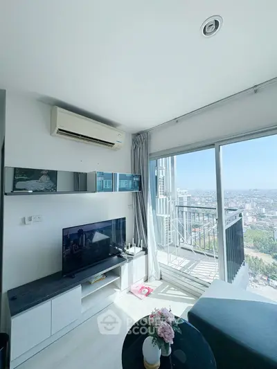 Modern living room with panoramic city view and balcony access