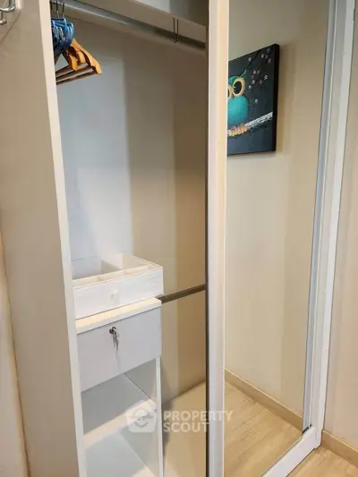 Spacious walk-in closet with modern design and ample storage space.