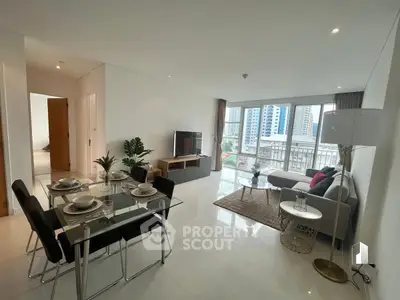 Spacious modern living room with dining area and city view, perfect for urban living.