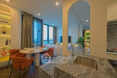 Luxurious open-plan living room with modern kitchen and elegant dining area