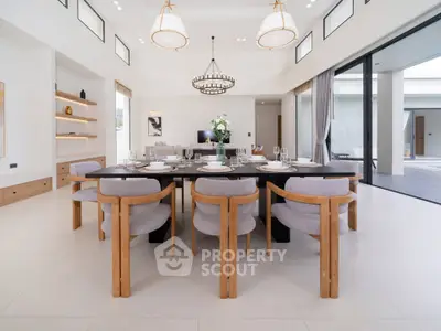 Luxurious dining room with elegant decor and large windows in modern home