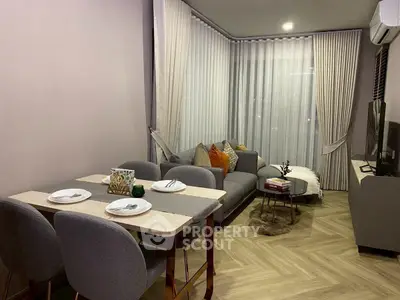 Modern living room with cozy dining area and stylish decor