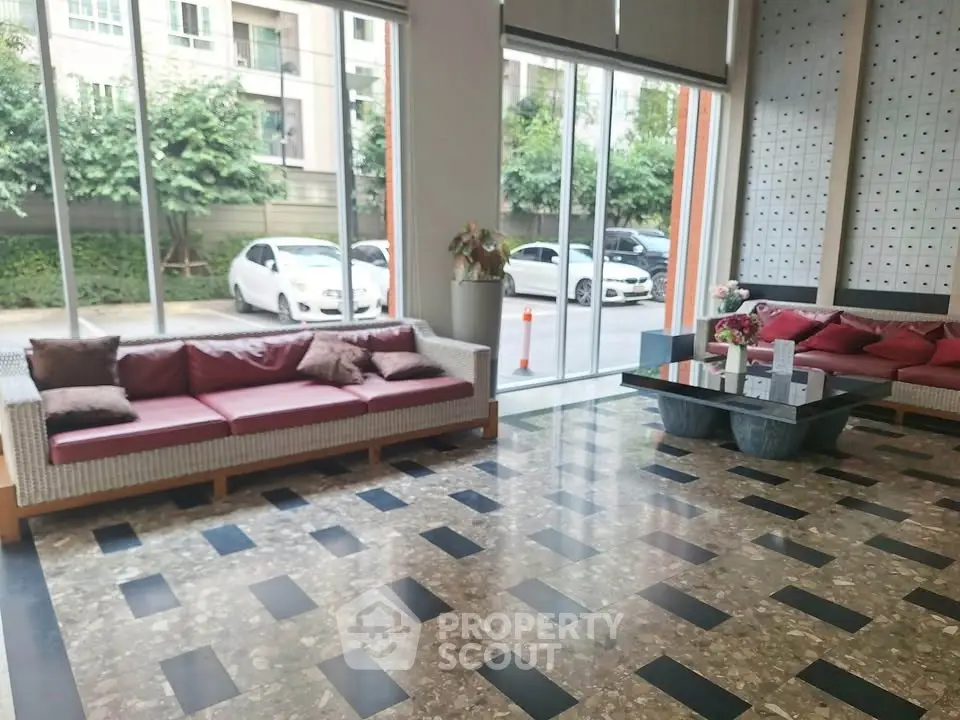 Spacious modern living room with large windows and stylish furniture