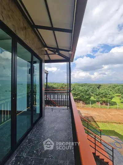 Stunning balcony with panoramic views of lush greenery and open skies