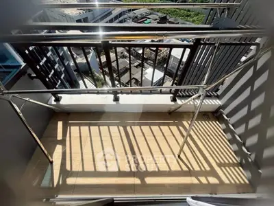 Modern balcony with sleek railing and city view, perfect for urban living.