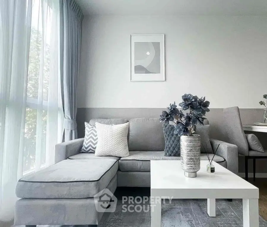 Modern living room with stylish gray sofa and elegant decor