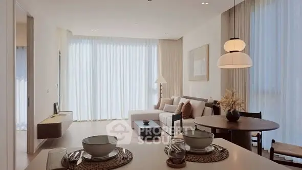 Elegant living room with modern decor and natural light, featuring a cozy seating area and dining space.