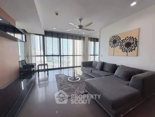 Spacious modern living room with large windows and stylish decor