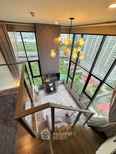 Luxurious duplex living room with floor-to-ceiling windows and stunning city view
