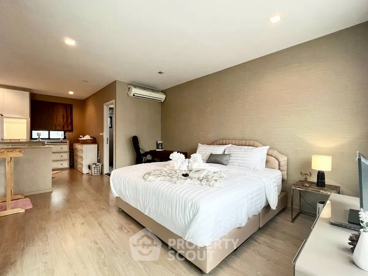 Spacious modern bedroom with elegant decor and open layout in luxury apartment