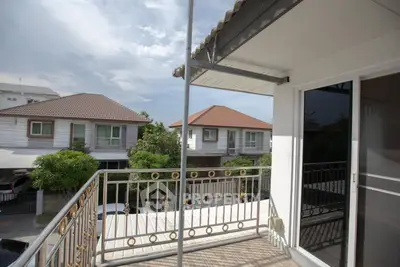 Charming balcony with scenic neighborhood view, perfect for relaxation and enjoying the outdoors.
