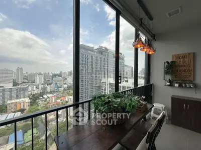 Stunning city view from modern balcony with stylish decor and large windows