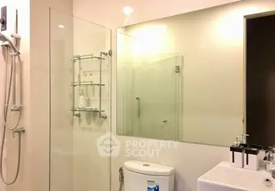 Modern bathroom with glass shower and sleek fixtures