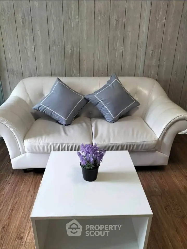Chic living room with elegant white sofa and modern coffee table
