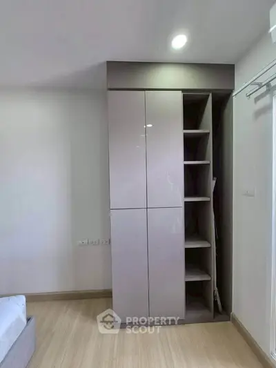 Modern bedroom with sleek built-in wardrobe and minimalist design