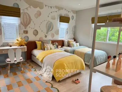 Charming children's bedroom with twin beds and playful decor