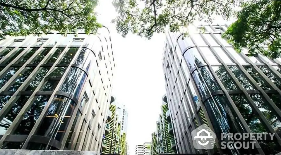 Stunning modern architecture of twin high-rise buildings with lush greenery