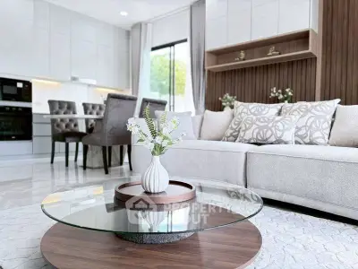 Elegant modern living room with stylish decor and open kitchen layout