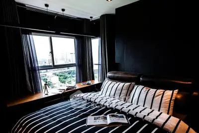 Luxurious bedroom with city view and stylish decor