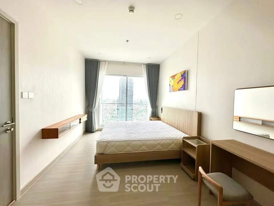 Spacious modern bedroom with city view and minimalist decor