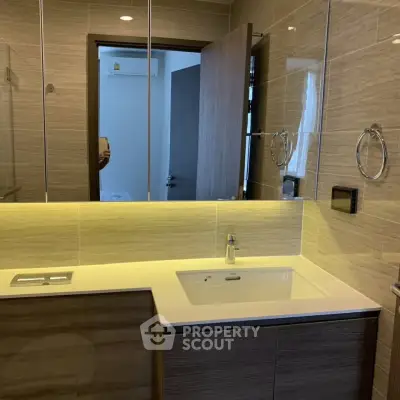 Modern bathroom with sleek design and elegant fixtures in a contemporary home.