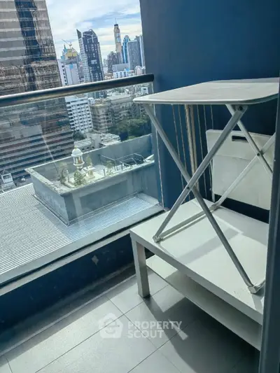 Urban balcony with city skyline view, perfect for relaxation and enjoying the vibrant cityscape.