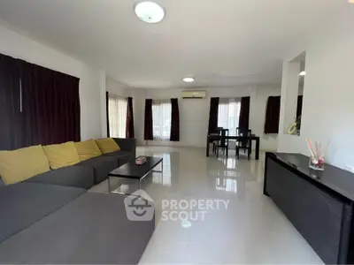 Spacious living room with modern furniture and natural light