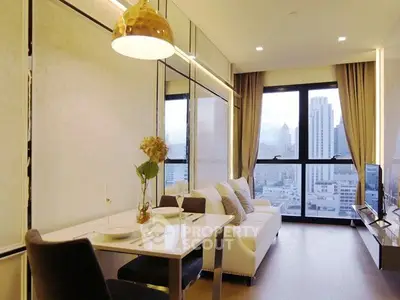 Luxurious living room with city view, elegant decor, and modern lighting in high-rise apartment.