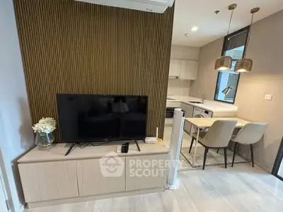 Modern living room with TV and stylish kitchen in open layout apartment