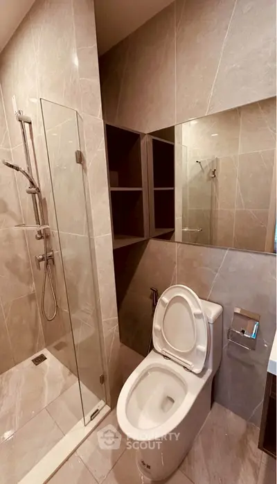 Modern bathroom with glass shower and sleek tile design