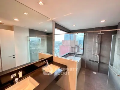 Luxurious modern bathroom with city view, featuring dual sinks and a spacious shower area.