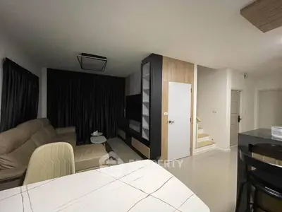 Modern living room with sleek furniture and stylish decor in a contemporary home.