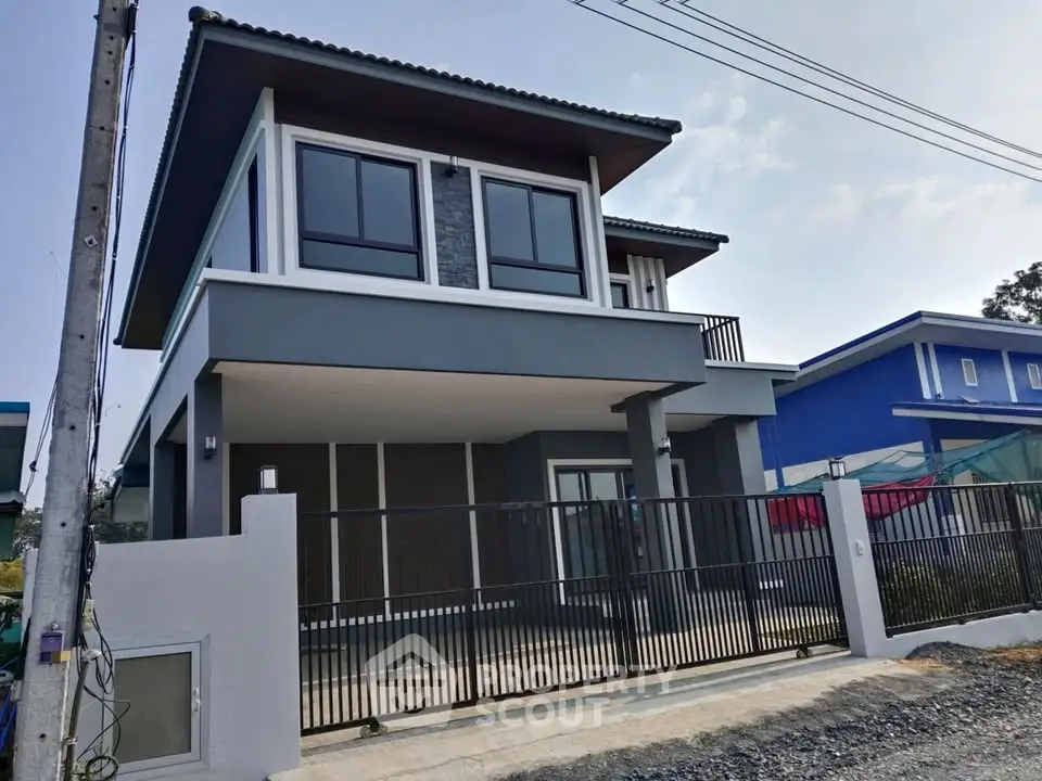 Modern two-story house with sleek design and spacious balcony