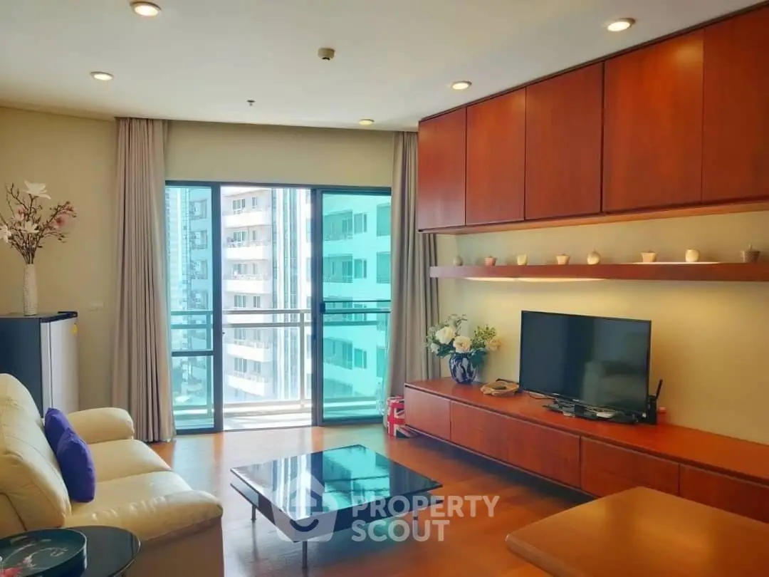 Modern living room with large windows and stylish wooden furniture in a high-rise apartment.