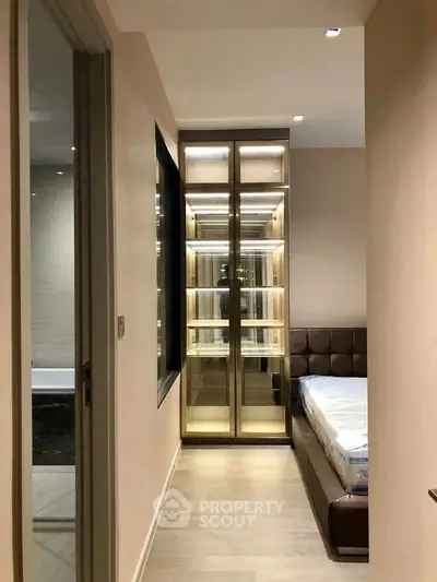 Modern bedroom with elegant lighting and sleek wardrobe design