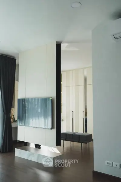 Modern living room with sleek TV setup and elegant decor