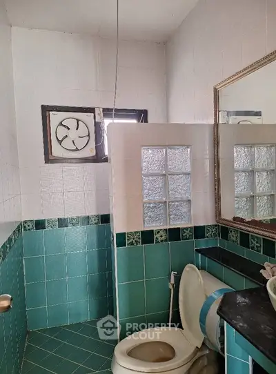 Charming bathroom with vintage tiles and modern fixtures, perfect for a cozy home upgrade.