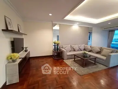 Spacious living room with elegant decor and cozy seating area, perfect for relaxation and entertainment.