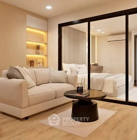 Modern living room with cozy sofa and stylish decor adjacent to a bedroom.