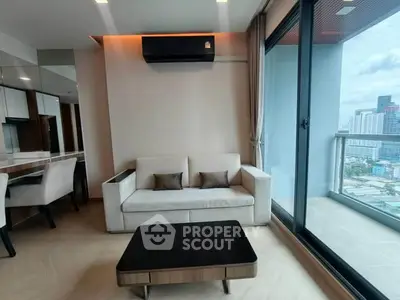 Modern living room with city view and balcony access in luxury apartment