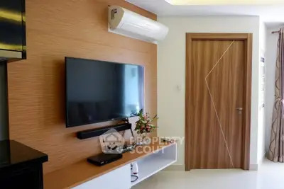 Modern living room with sleek TV setup and stylish wooden accents
