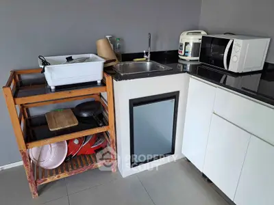 Compact kitchen with modern appliances and sleek storage solutions