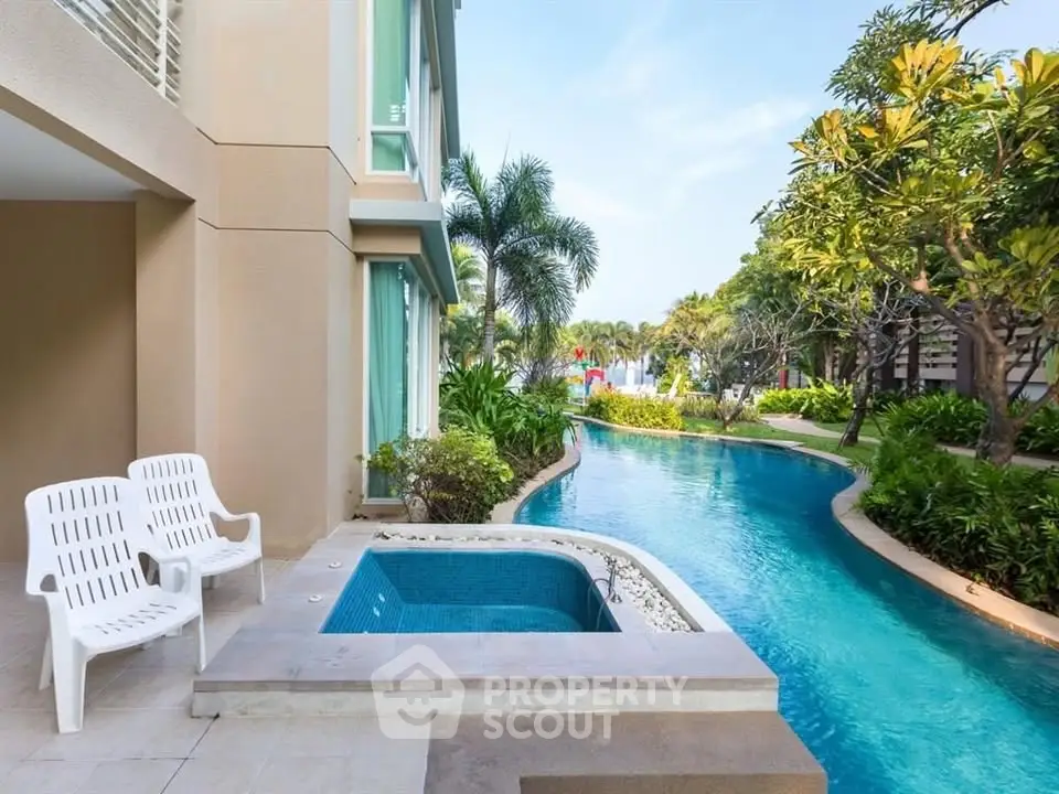 Luxurious poolside view with lush greenery and modern architecture, perfect for relaxation and leisure.
