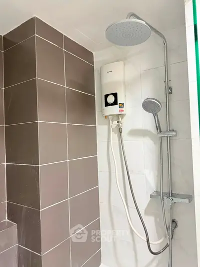 Modern bathroom with sleek shower system and stylish tile design